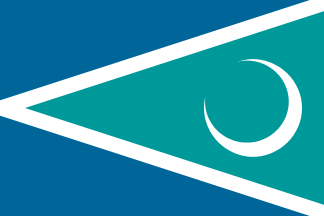 [white crescent moon in a turquoise fly triangle bordered in white, all on a field
of darker greenish-blue]